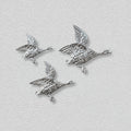 Shimmering Ducks in Silver