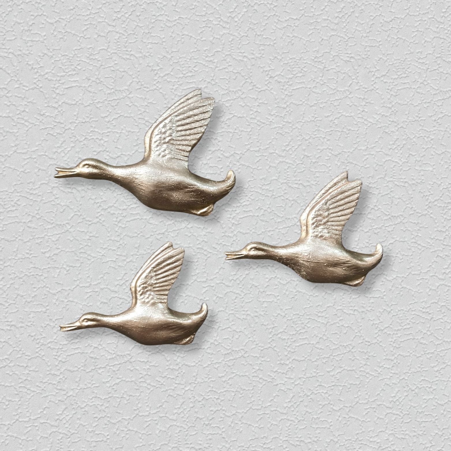Shimmering Ducks in Gold